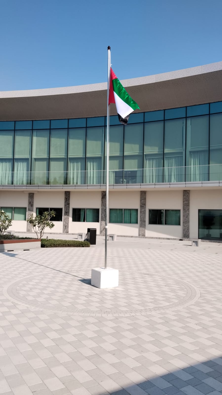 6 m flag pole with UAE flag in courtyard